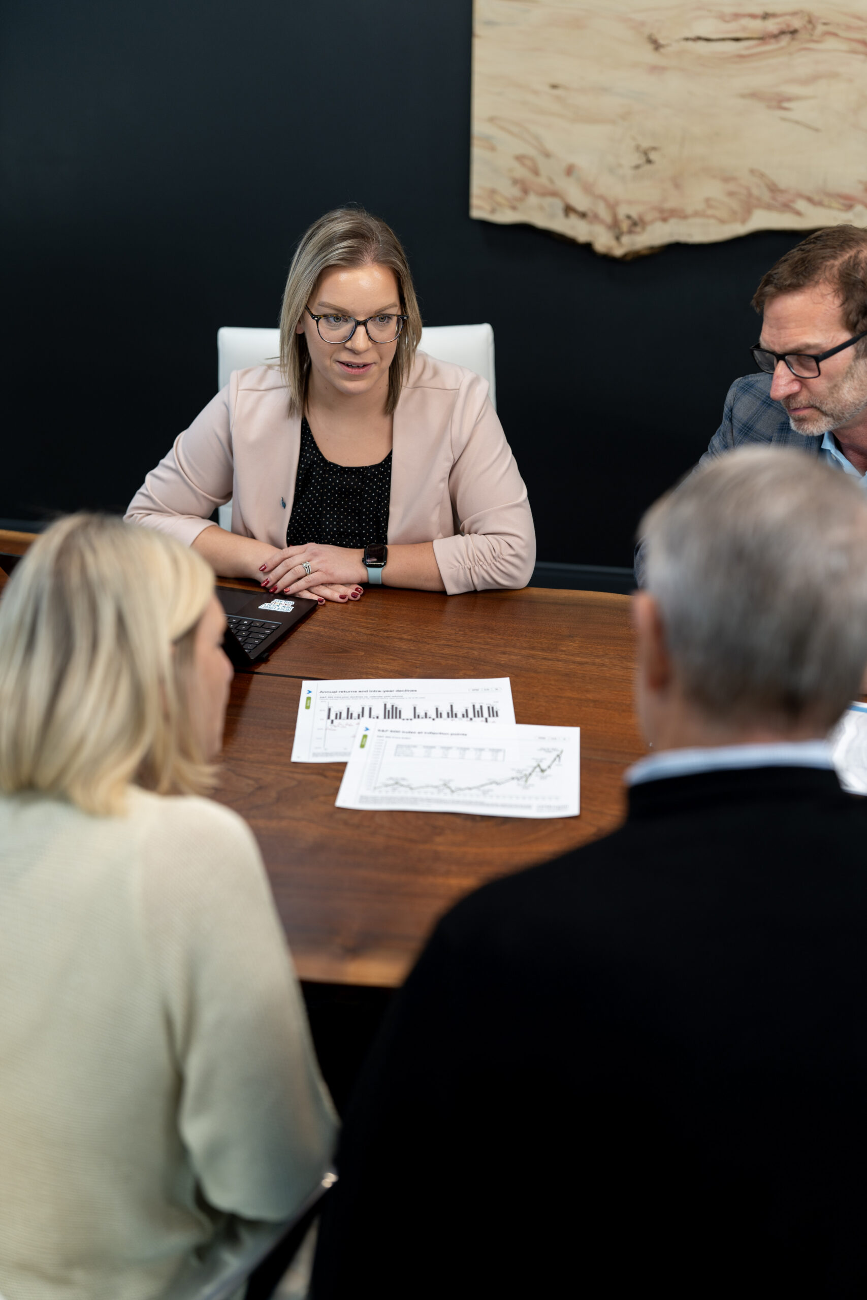 A Keeler & Nadler advisor reviewing a wealth management plan with clients
